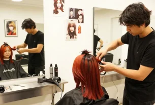 Stylish hair salon scene showcasing a model with a trendy hair style trend and a professional stylist.